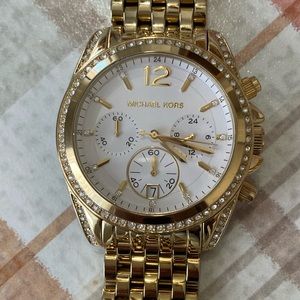 Michael Kors gold and little diamonds.  Like new needs a battery.